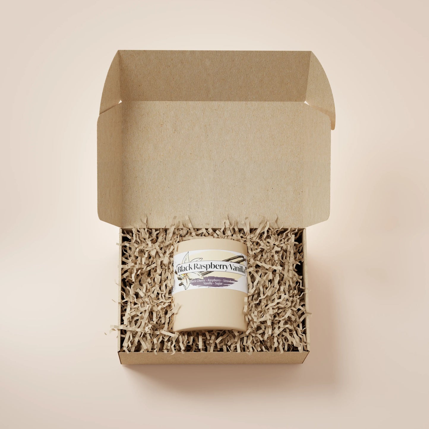 Cream Ceramic 12oz Black Raspberry Vanilla Scented Candle in a box with crinkle paper.