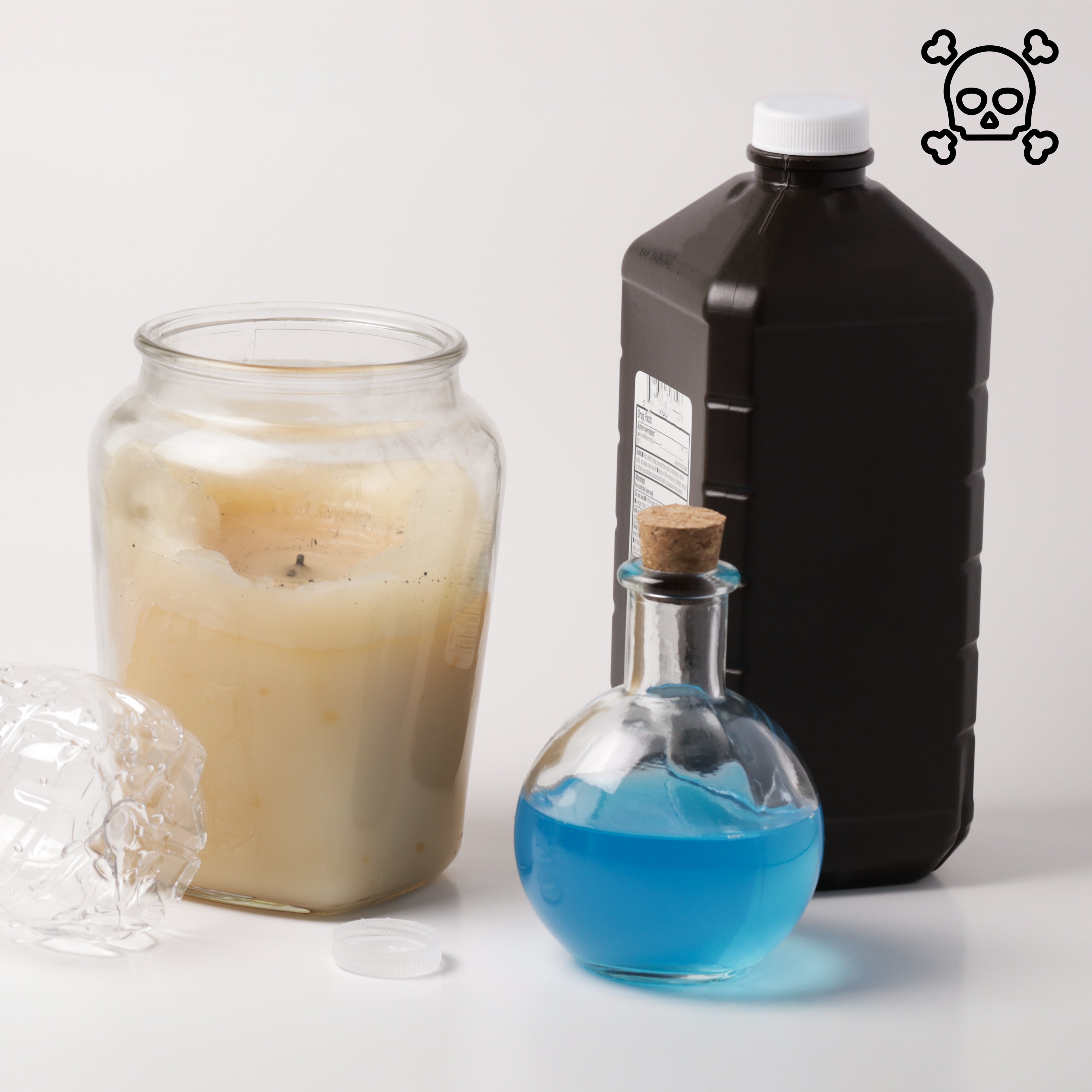 A bad candle next to toxic products representing bad ingredients