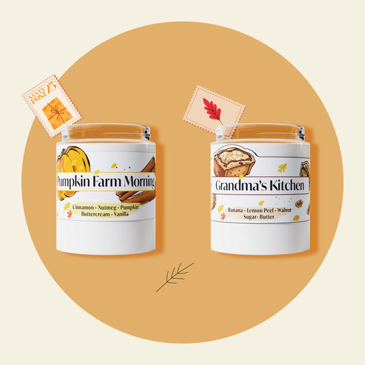 Two candles with labels 'Pumpkin Farm Morning' and 'Grandma's Kitchen' on an orange background.