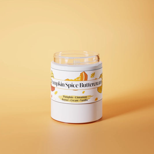 Jar of pumpkin spice buttercream candle on an orange background